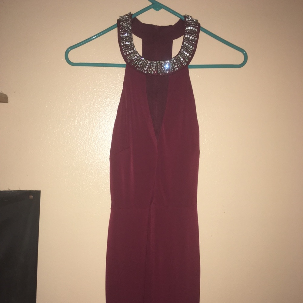 Maroon body-con dress with beading and open back.